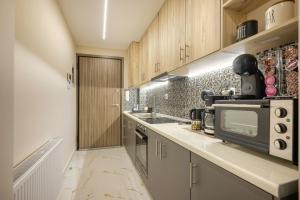 Η κουζίνα ή μικρή κουζίνα στο Vahal Luxury Studio Ioannina +6 φωτογραφίες