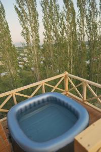 a blue bath tub sitting on top of a deck at IN CLOUDS RESORT Byurakan in Antarut