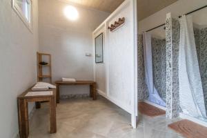 a room with a hallway with a table and a window at Agricampeggio Equinox in Carpignano Sesia +75 photos