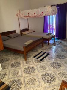 Giường trong phòng chung tại Villa Francisca