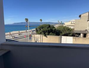 a view of the ocean from a balcony at Stella Marina Home Holidays in Gioia Tauro