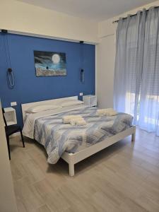 Un ou plusieurs lits dans un hébergement de l'établissement Vento di Mare