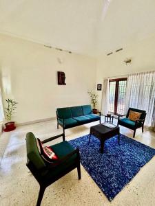 Posezení v ubytování Mango Tree Villa