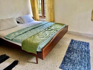 Postel nebo postele na pokoji v ubytování Mango Tree Villa