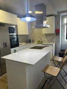 Kuchyň nebo kuchyňský kout v ubytování Finu Hub Guesthouse