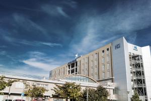 a building with aeg on the top of it at Hotel Galilei in Pisa