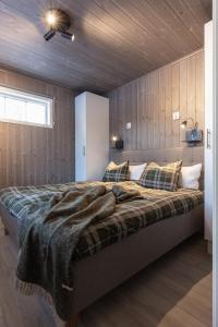 Postel nebo postele na pokoji v ubytování Skarvrusäterns Fjällby - Tänndalen