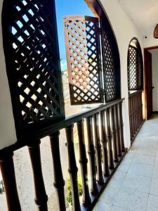 a fence in front of a building with a window at Casa Centro Historico Hotel in Cartagena de Indias