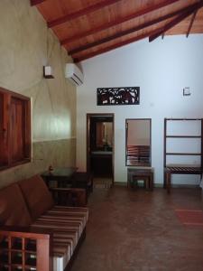 a living room with a couch and a table at Villa Habarana in Habarana