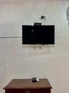 a flat screen tv hanging on a wall at Casa Centro Historico Hotel in Cartagena de Indias