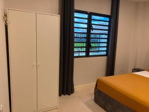 Postel nebo postele na pokoji v ubytování MGM Apartments Paramaribo