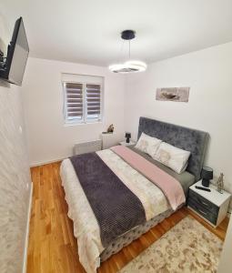 Postel nebo postele na pokoji v ubytování Apartman Damjan Sokobanja