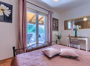 Postel nebo postele na pokoji v ubytování Villa Palma Karojba