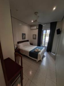 Łóżko lub łóżka w pokoju w obiekcie Hostal Villamañez