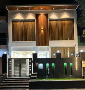 a house with a staircase in front of it at Yati Suites in Greater Noida