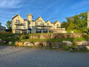 a large house on top of a hill with rocks at Studio Rustico Chic Nearby Piedmonts Hotspots in Piedmont