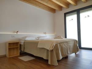 Postel nebo postele na pokoji v ubytování Agriturismo Verdecielo