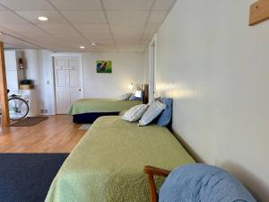a room with two beds in a room at Mudges Bluff Waterfront Retreat in Lubec