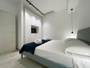 Postel nebo postele na pokoji v ubytování Dione Casa Vacanze Donnalucata - Blu