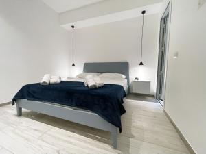 Postel nebo postele na pokoji v ubytování Dione Casa Vacanze Donnalucata - Blu