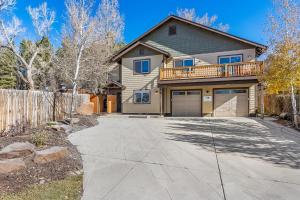 a large house with a fence and a driveway at Decorated for the Holidays! 2BDR Home in Downtown Flagstaff in Flagstaff
