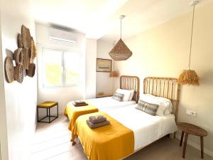 Postel nebo postele na pokoji v ubytování Appartement NoBe Es Pujols proche plage, vue mer
