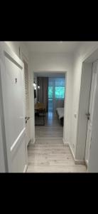 an empty hallway with a room with a table at Terasa Baniei in Bucovăţ