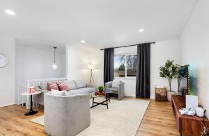 a living room with a couch and a table at Spacious and Cozy 5 Bed 3 Bath Vacation House W 2 King 3 Queen! Sleep 12! 15Min to Red Rocks in Arvada