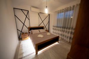 Postel nebo postele na pokoji v ubytování Aila Apartament
