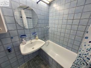 Koupelna v ubytování Apartment Grimmingsuite + 13 fotografií