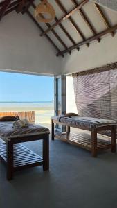 Postel nebo postele na pokoji v ubytování Sadi Beach House
