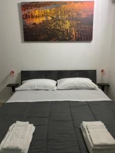 A bed or beds in a room at Room Mazzini