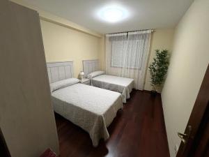 Postel nebo postele na pokoji v ubytování Las Camelias