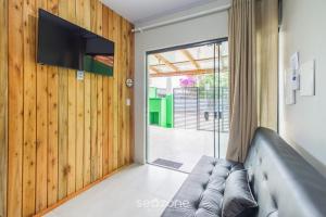 Et tv og/eller underholdning på RUC - Casas a 270m da Praia do Canto Grande