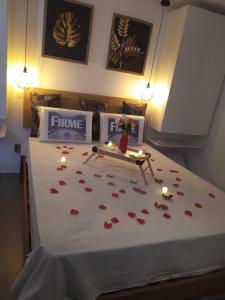 a bedroom with a bed with hearts on it at 004 Suite - Banheira de imersão - PRAIA -Temp Ambiente in João Pessoa