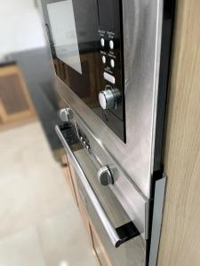 a microwave oven sitting on top of a counter at Spring Valley Vista, Ocean View Apartment Ocho Rios in Tower Isle