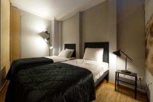 Postel nebo postele na pokoji v ubytování Daugava rrlux free parking