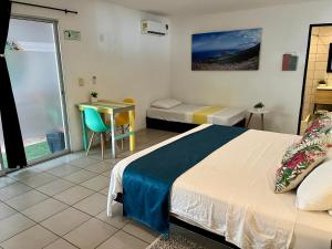 Ένα ή περισσότερα κρεβάτια σε δωμάτιο στο Ocean Lovers Hostel & Apartments