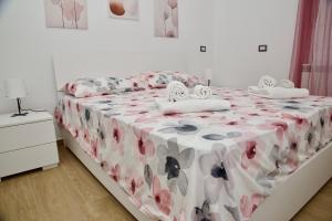 Ένα ή περισσότερα κρεβάτια σε δωμάτιο στο Casa Amare Aeroporto Fiumicino