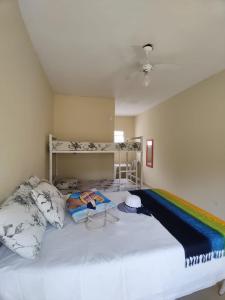 Postel nebo postele na pokoji v ubytování Suítes Córdoba SP