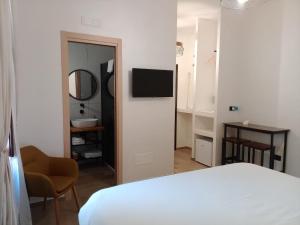 Μια τηλεόραση ή/και κέντρο ψυχαγωγίας στο Hasu Rental Rooms