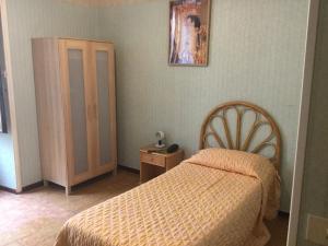 Postel nebo postele na pokoji v ubytování Hotel Touring