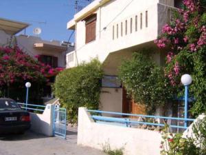 a house with a car parked in front of it at Hotel Elida in Platanes