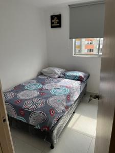Postel nebo postele na pokoji v ubytování Apartamento Amoblado