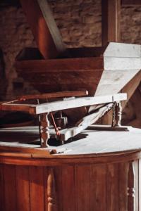 a table with a piece of wood on top of it at Vakantiewoning Wurfeldermolen in Maaseik +38 photos