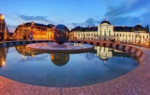 a fountain in a square in front of a building at Royal Residence in Old Town in Staré Mesto