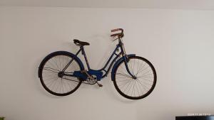 a bike is hanging on a wall at Tirwal Suite Judería in Teruel
