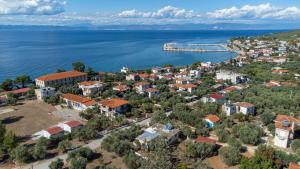 an aerial view of a small town by the water at Sivi's Vacation Homes in Skala Kallirachis