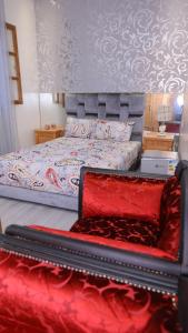 Postel nebo postele na pokoji v ubytování Riad Sevilla