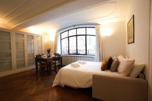 Una cama o camas en una habitación de CardinalMorone